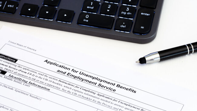 Application,For,Employment,Benefits,Form,With,Computer,Keyboard,And,Pen