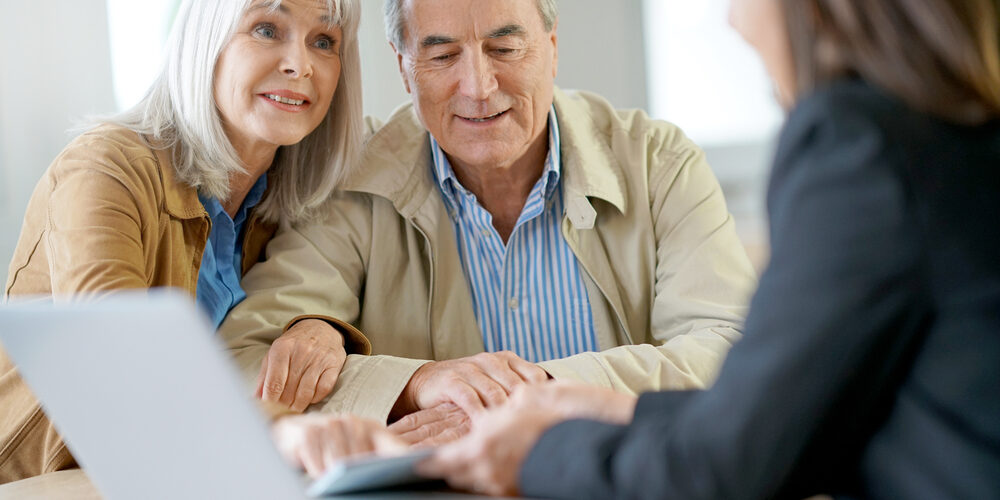 Senior,Couple,Meeting,Financial,Adviser,For,Investment