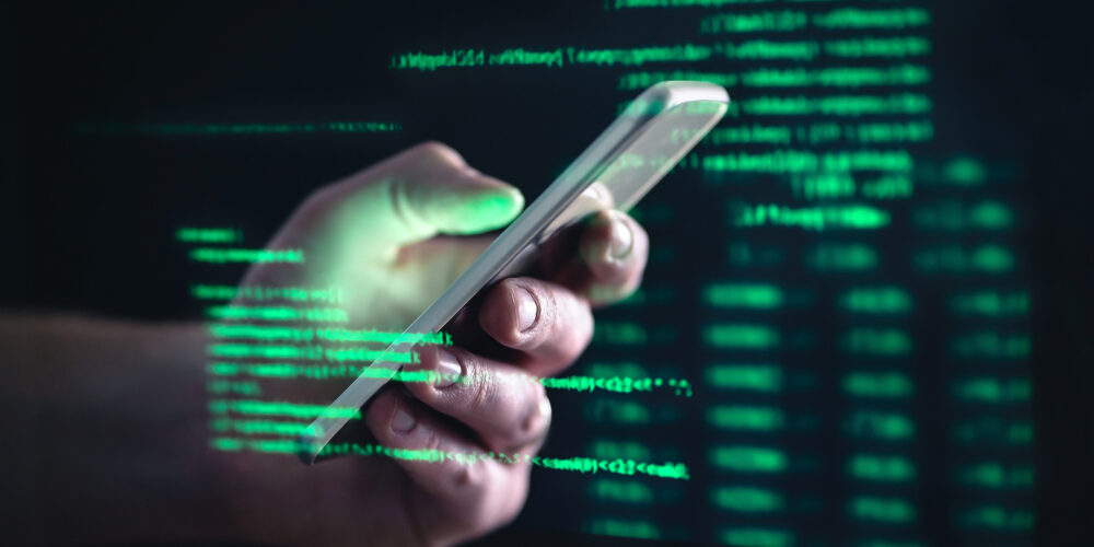 Darkweb,,Darknet,And,Hacking,Concept.,Hacker,With,Cellphone.,Man,Using