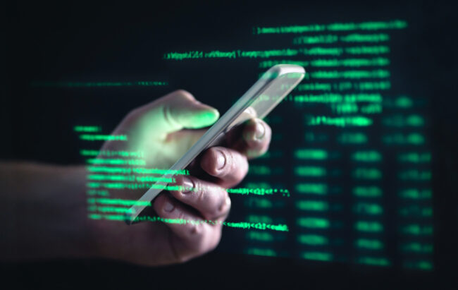 Darkweb,,Darknet,And,Hacking,Concept.,Hacker,With,Cellphone.,Man,Using