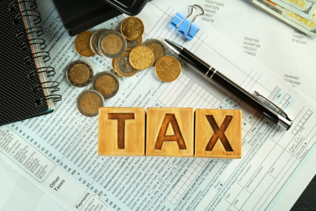 Wooden,Blocks,With,Word,Tax,On,Documents