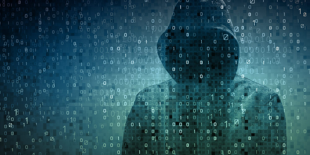 Hacker,Over,A,Screen,With,Binary,Code