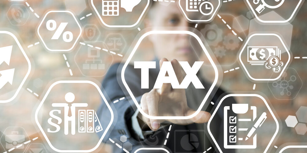 Young,Businessman,Using,Innovative,Virtual,Touchscreen,Presses,Tax,Button.,Tax