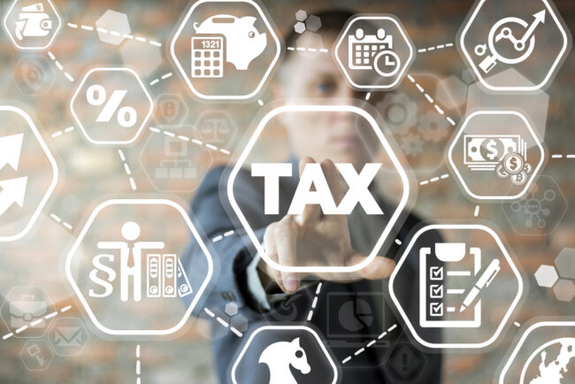 Young,Businessman,Using,Innovative,Virtual,Touchscreen,Presses,Tax,Button.,Tax