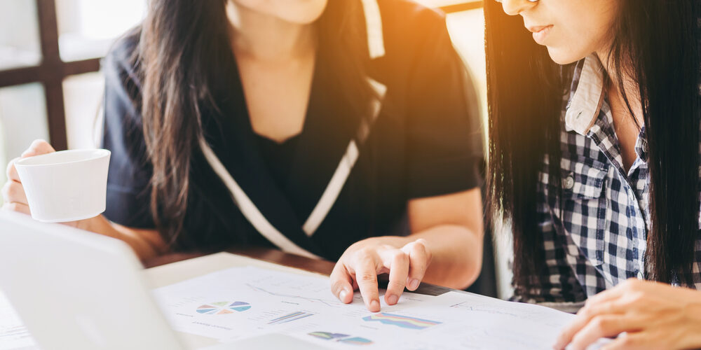 Two,Business,Woman,Investment,Consultant,Analyzing,Company,Annual,Financial,Report