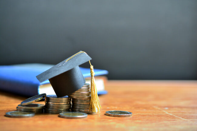Hat,Graduation,Model,On,Money,Coins,Saving,For,Concept,Investment