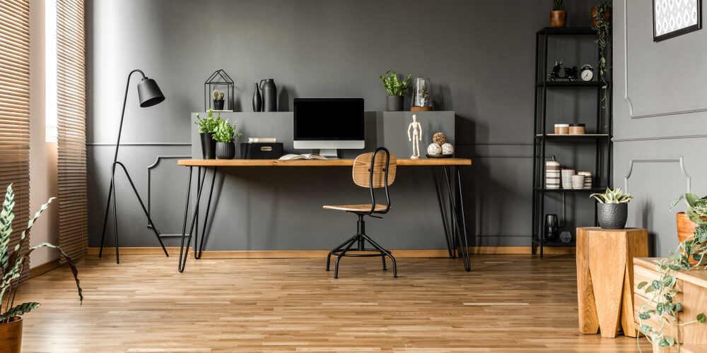 Chair,At,Wooden,Table,With,Computer,Monitor,And,Plants,In